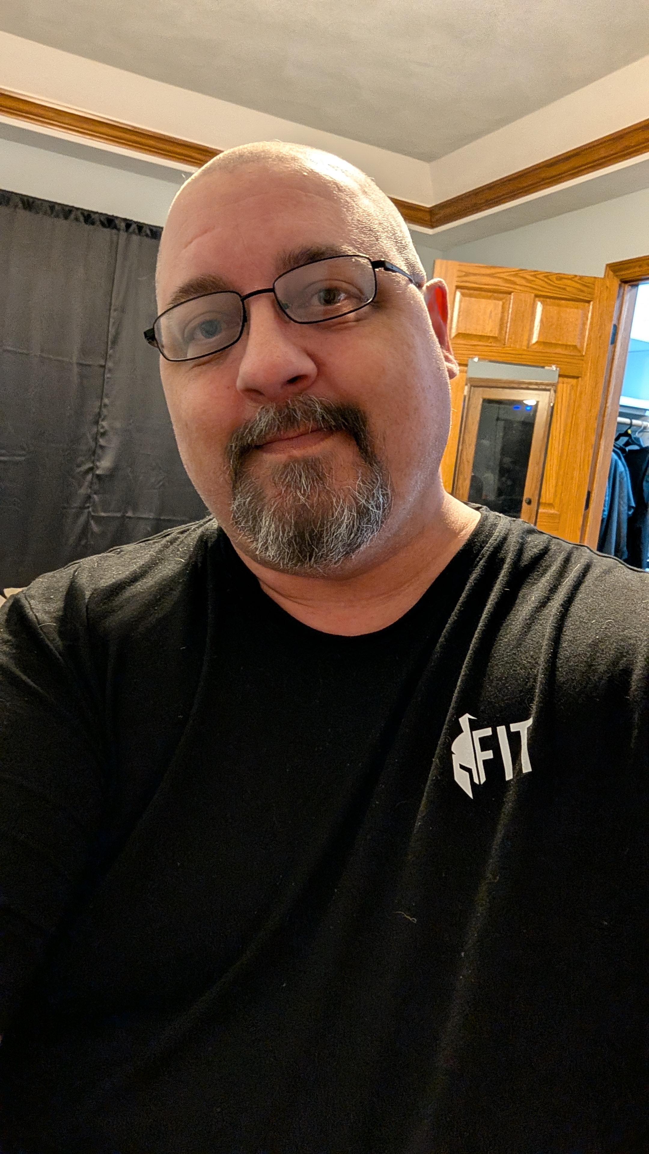 Recent photo of Chad wearing a black shirt and glasses